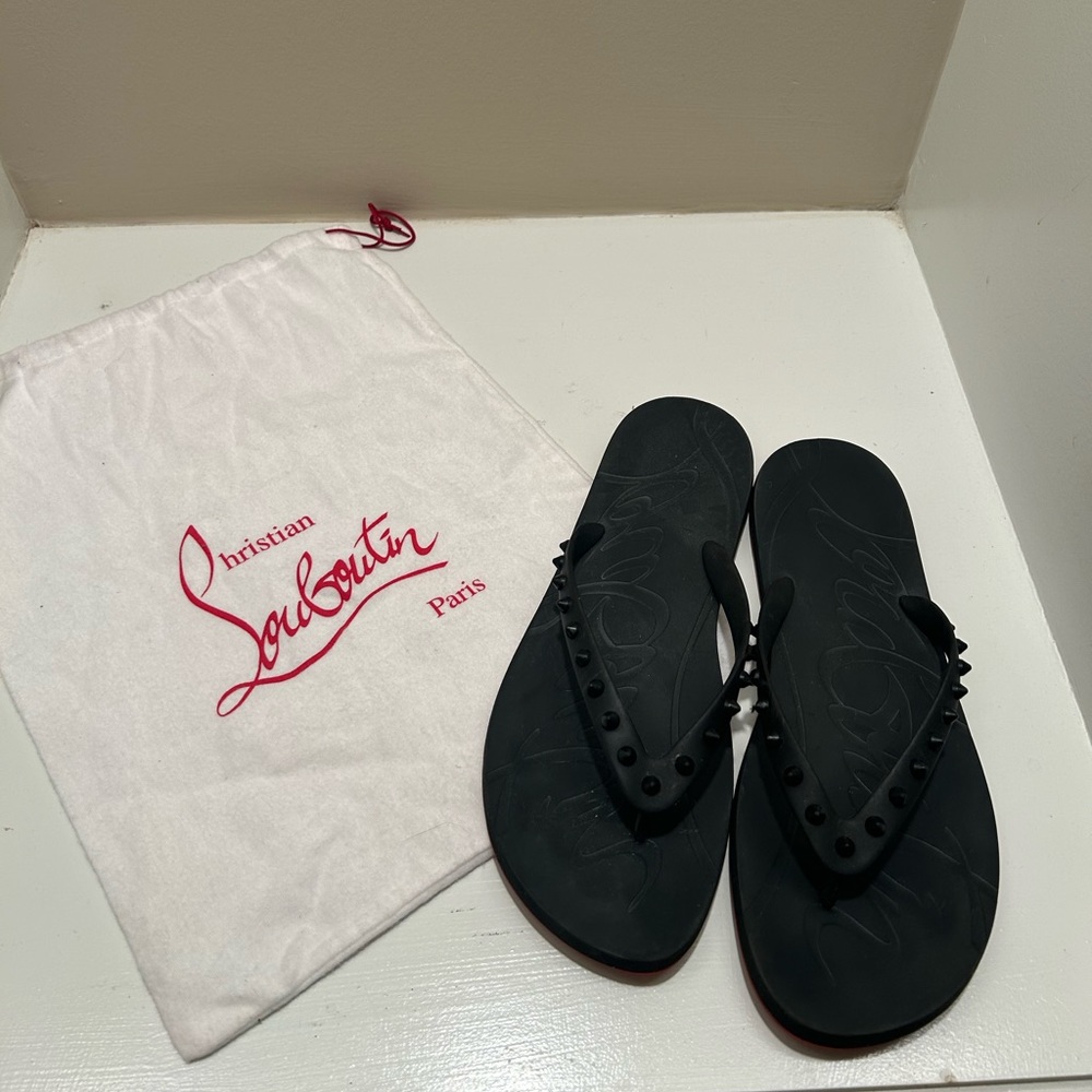 Christian Louboutin 
Loubi Spike Rubber Flip Flops